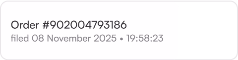 Order status text element displaying a unique order number, filing date, and timestamp for user account history or order tracking interfaces.
